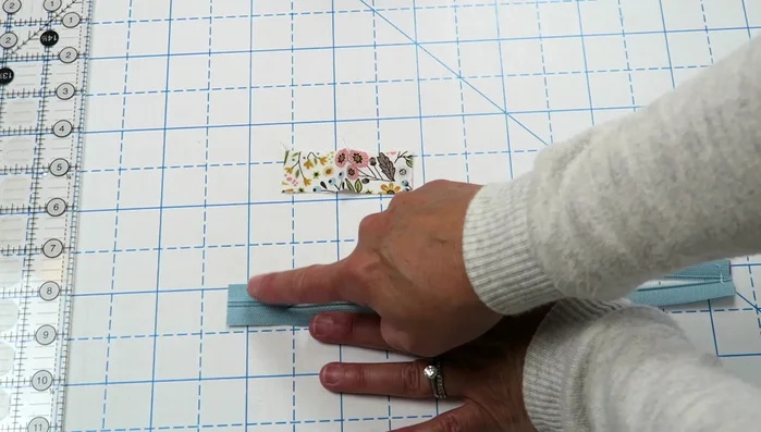 Create and attach zipper pulls.