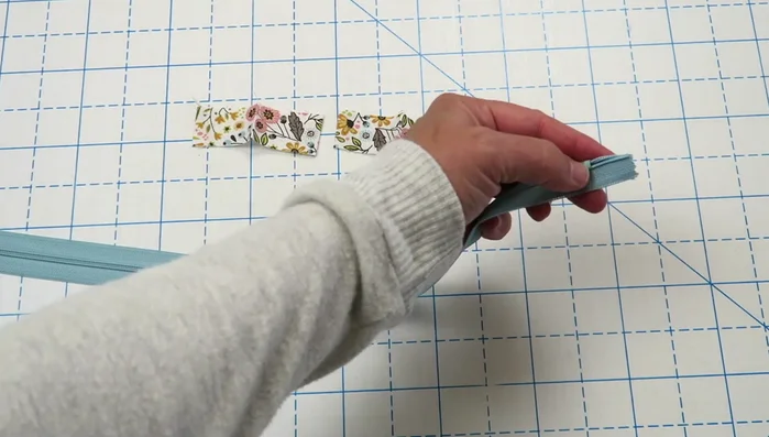 Create and attach zipper pulls.