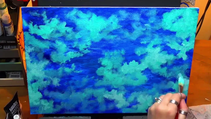 Applying another thin glaze tinted with a tiny bit of blue to further refine the background.