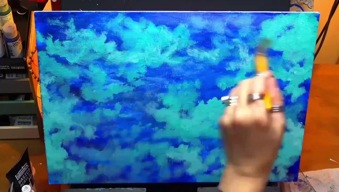 Applying another thin glaze tinted with a tiny bit of blue to further refine the background.