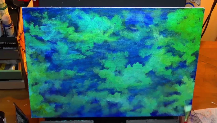 Applying another thin glaze tinted with a tiny bit of blue to further refine the background.