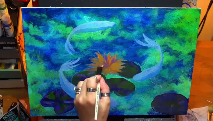 Adding yellows and purples to the lotus flower.