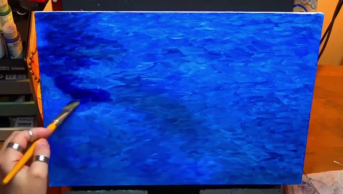 Using a stiff bristle brush to add turquoise, creating a mix of harsh and soft edges.