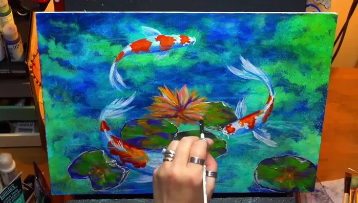 Adding final details using a liner brush to enhance the overall composition.