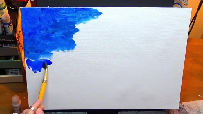 Using a stiff bristle brush to add turquoise, creating a mix of harsh and soft edges.