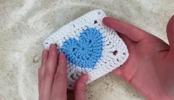 Fasten off, leaving a loop. Join and complete the remaining buttons.