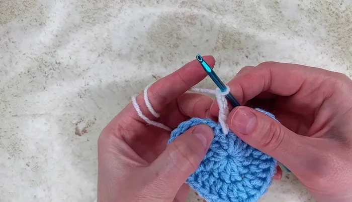 Chain two, work one double crochet, then work half double crochet, single crochet, and double crochet into the next stitches, followed by treble, double treble, and treble again. Repeat the pattern for the remaining stitches.