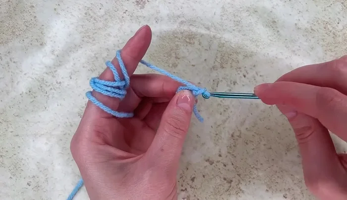 Work 12 double crochet stitches into the ring.