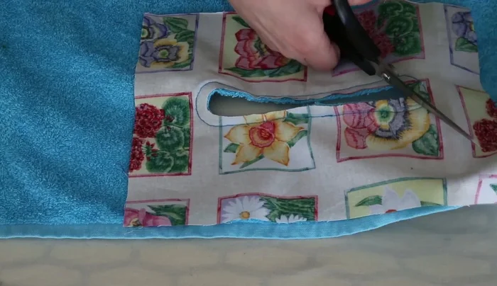 Fold the seam allowance inward and stitch it down, securing the raw edges.