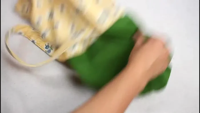 Turn and finish: Turn the bag right side out through the opening left in the lining. Close the opening with a top stitch or hand-sew a ladder stitch. Press the top edge and top stitch around the bag.