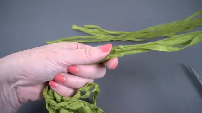 Tie all six chains together using a simple overhand knot, keeping the knots close together.