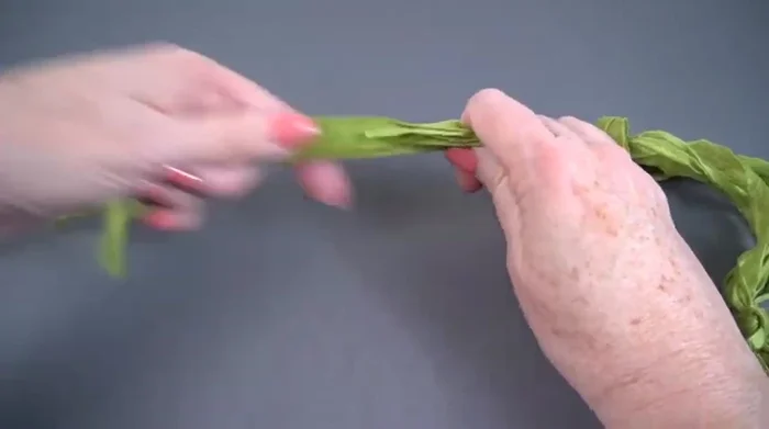 Tie an overhand knot at each end to secure the strands.