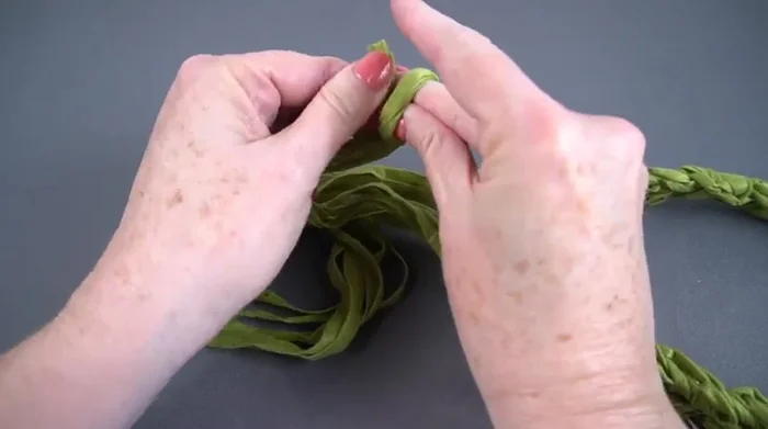 Tie an overhand knot at each end to secure the strands.