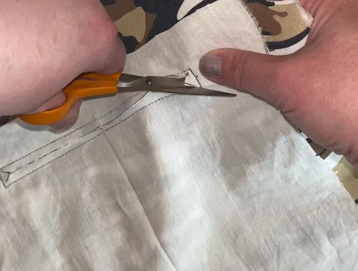 Push the pocket lining through the opening, press to create a neat finish.