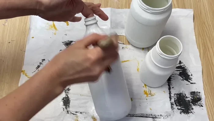 Apply the third coat using a sponge, dabbing it on for a smooth finish. This helps eliminate brush strokes.