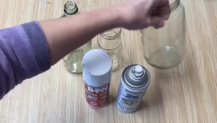 Lightly spray the glass jars with flat white spray paint or primer. This creates a base for the chalk paint to adhere to.
