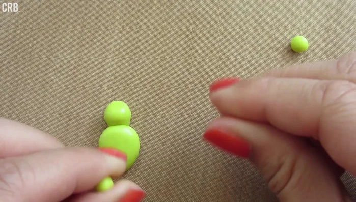 Make two log-shaped flippers and attach them to the bottom of the shell.