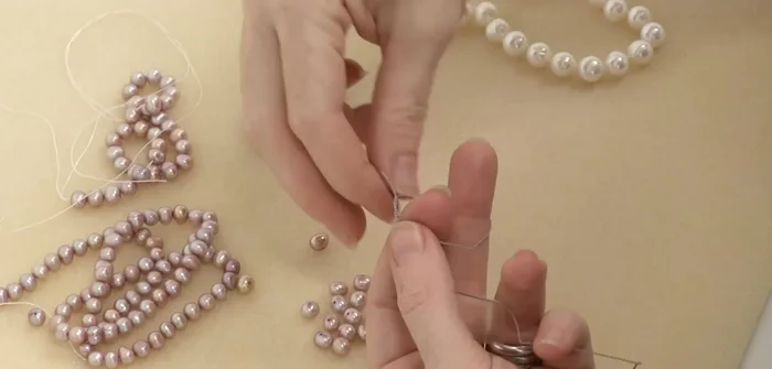 Continue knotting: Repeat steps 5 and 6 until all pearls are strung and knotted.