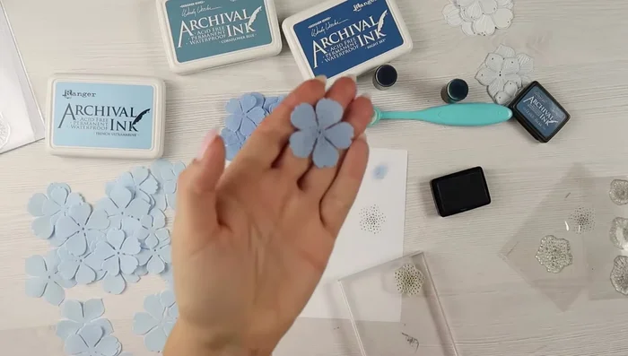 Stamp the centers of the flowers with your desired design (optional).