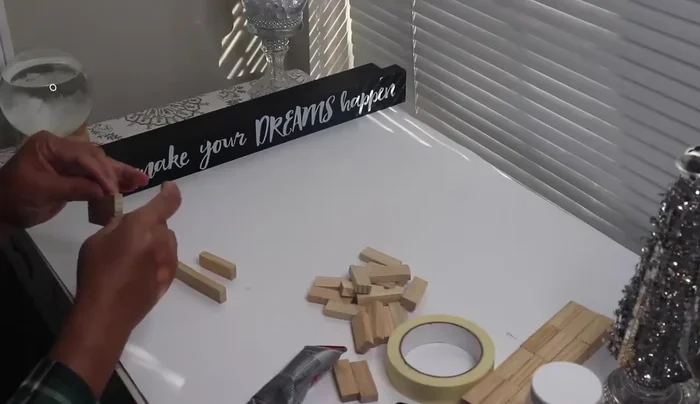 Construct side pieces: Glue tower blocks together to form two identical rectangular pieces (24 blocks each). Use masking tape to hold them in place while drying.