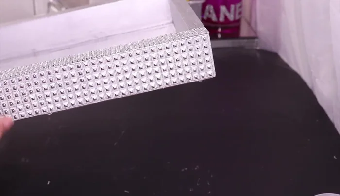 Add Bling: Decorate the tray's exterior and interior with bling wrap and rhinestones.