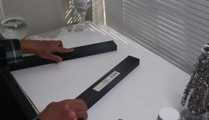 Prepare the wooden pieces: Remove labels and residue from the Dollar Tree signs and wooden sticks.