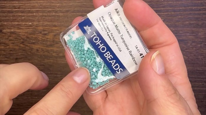 Gather materials: wood beads, ceramic beads, seed beads, daisy spacers, metal charms, jump rings, beading wire, French wire closure, toggle clasp, crimp beads.