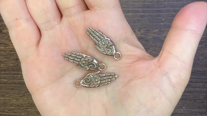 String the wood beads, seed beads, and ceramic beads onto the wire, creating your desired pattern.