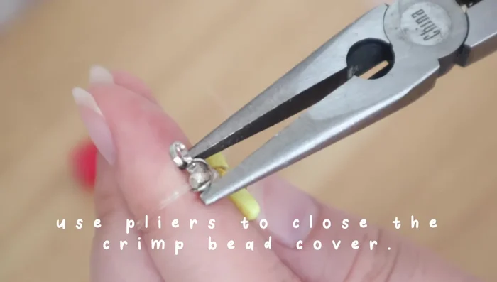 Cut off excess cord and add a jump ring to the hook.