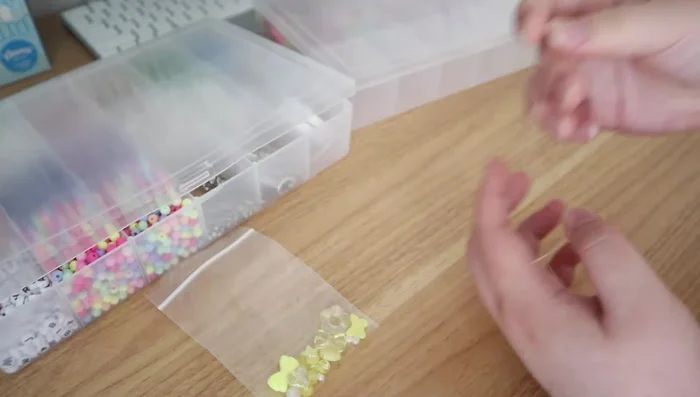 Cut a piece of stretch cord and fold it in half. Thread both ends through a 2mm seed bead.