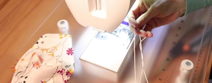 Attach the elastic cording, ensuring it can be easily adjusted.