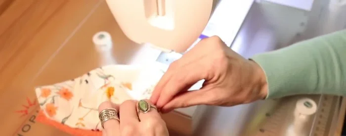 Top stitch along the top and bottom edges of the mask, and optionally along the nose bridge, for reinforcement and a clean finish.