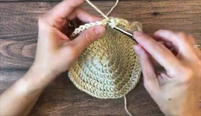 Ribbing: Change to a contrasting color (optional). Chain 3 (or alternative chain 3). *Front post double crochet, double crochet*; repeat from * to * around. Repeat for 1 round (baby sizes), 2 rounds (toddler/preschool/child), or 3 rounds (adult sizes).