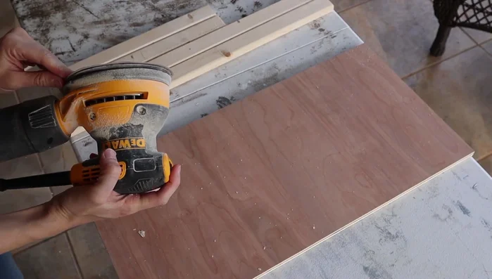 Stain the frame (e.g., dark walnut). Apply stain using sanding pads.