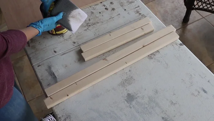 Stain the frame (e.g., dark walnut). Apply stain using sanding pads.
