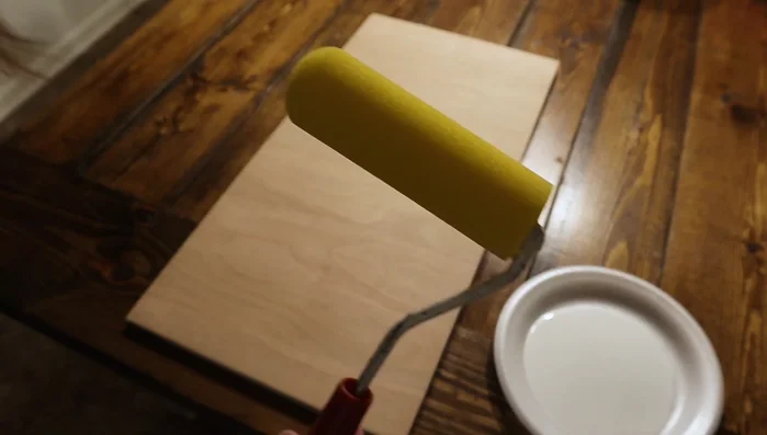 Apply black paint using a dabbing motion, avoiding globs to prevent bleeding. Let it dry completely.