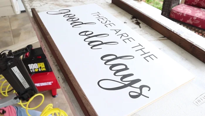 Attach the frame to the sign using a brad nailer and 1 1/2 inch nails.
