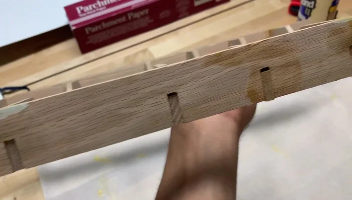 Sand down any rough edges or excess glue after the glue has dried completely.