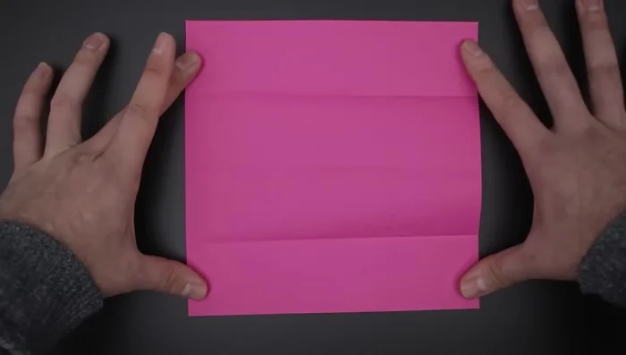 Repeat step 3 to divide the paper into 16 smaller squares.