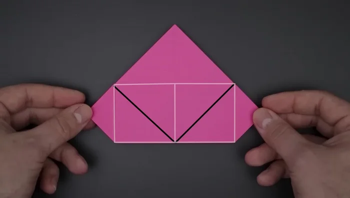 Fold the remaining card in the middle up, then turn over and repeat on the other side.