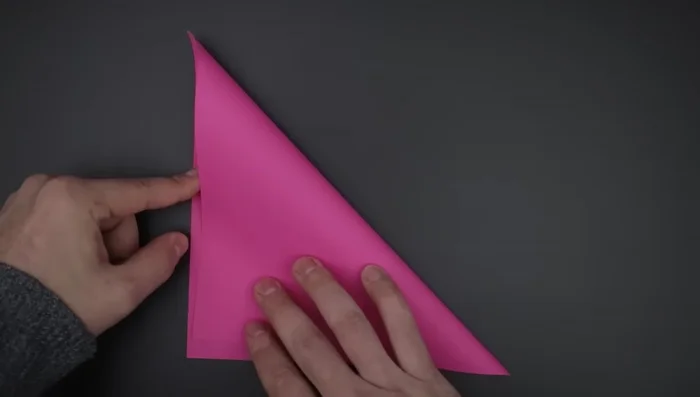 Repeat step 3 to divide the paper into 16 smaller squares.