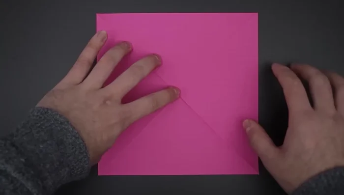 Repeat step 3 to divide the paper into 16 smaller squares.