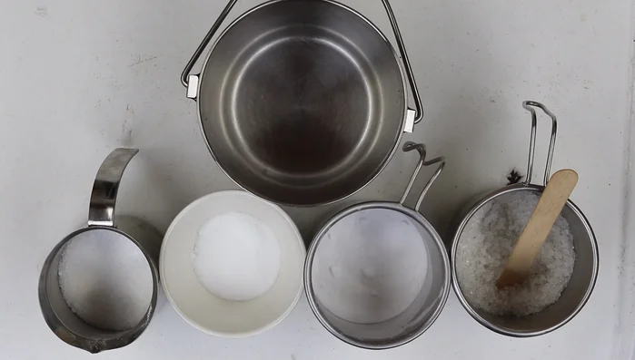 Create candles by dipping wicks in beeswax.