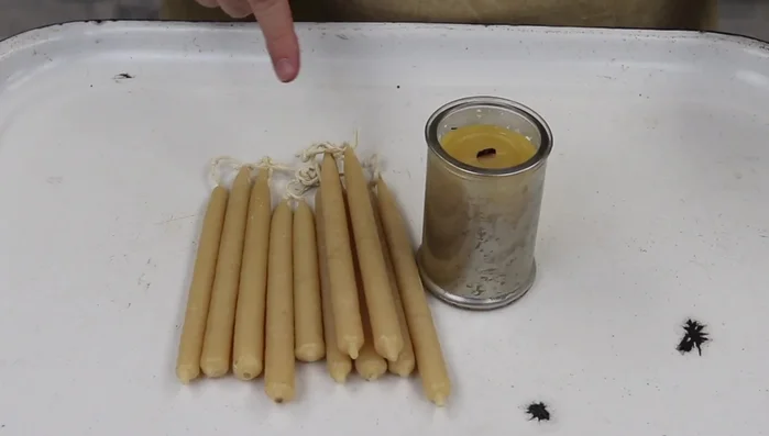 Create candles by dipping wicks in beeswax.