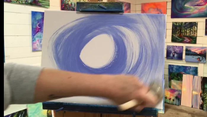 Create a winter sky background. Using a large round chalk brush and light blue violet, paint big circles covering the entire canvas except for the middle portion where the moon will be.