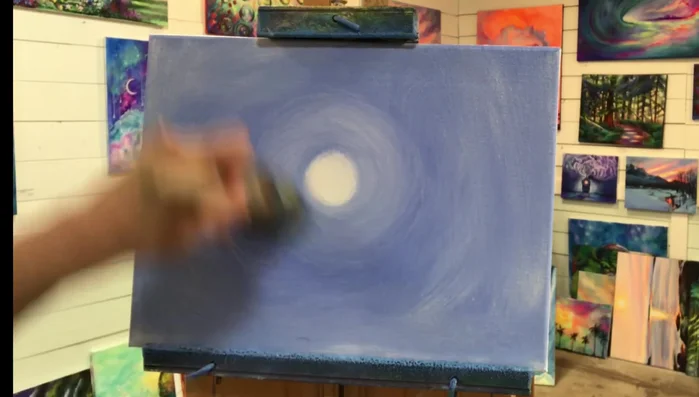 Define the horizon. Using the same brush, create a horizon line under the moon by pulling the brush back and forth.