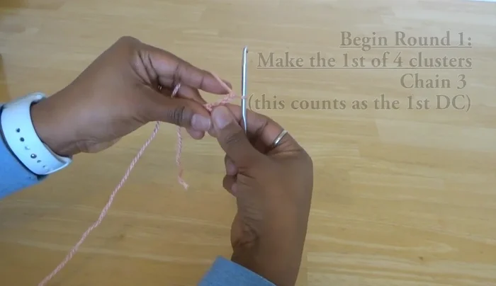 Double crochet six times into the same loop as the previous popcorn stitch.