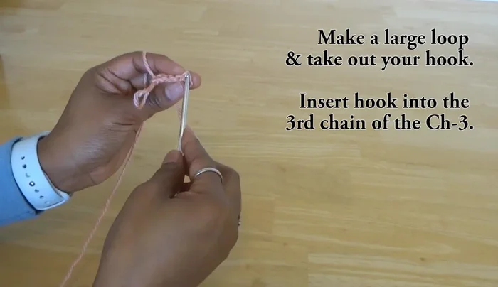 Double crochet six times into the same loop as the previous popcorn stitch.