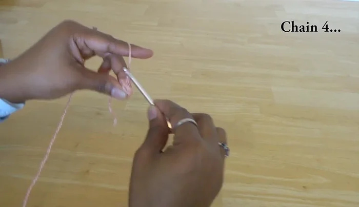 Double crochet six times into the same loop as the previous popcorn stitch.