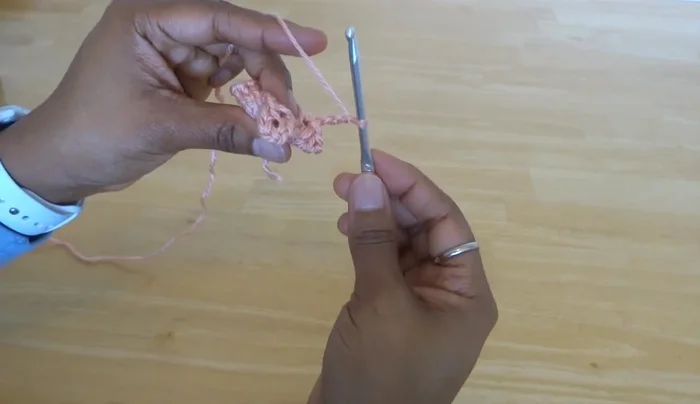 Slip stitch to connect the last popcorn stitch to the first popcorn stitch of the round.